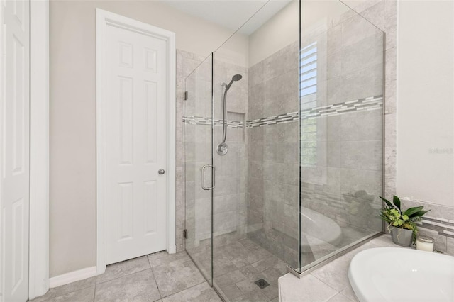 1113 Fieldstone Cir, Oviedo, FL 32765 - bathroom with a shower stall, a bath, and tile patterned floors