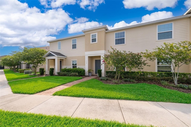 110 Claire Ln, Davenport, FL 33837 - multi unit property featuring a front yard and stucco siding