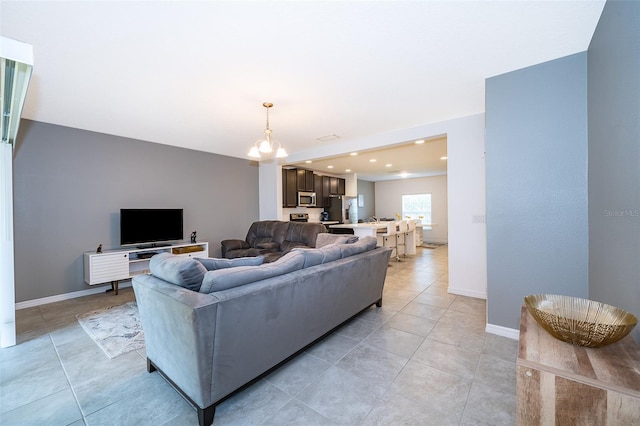 110 Claire Ln, Davenport, FL 33837 - living area featuring a chandelier, baseboards, light tile patterned floors, and recessed lighting