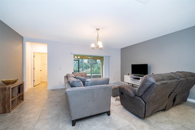 110 Claire Ln, Davenport, FL 33837 - living area with a chandelier, light tile patterned floors, and baseboards