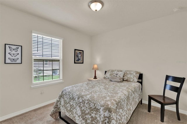 bedroom featuring carpet flooring and baseboards