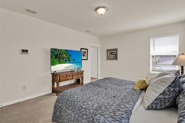 carpeted bedroom with baseboards