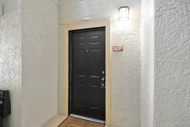 1321 Arbor Vista Loop Unit 301, Lake Mary, FL 32746 - doorway to property featuring stucco siding