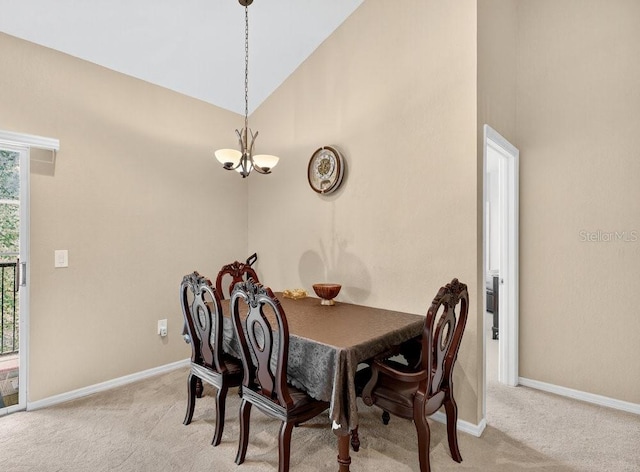1321 Arbor Vista Loop Unit 301, Lake Mary, FL 32746 - dining area featuring a chandelier, light colored carpet, and high vaulted ceiling