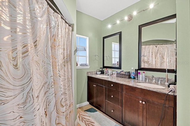 1321 Arbor Vista Loop Unit 301, Lake Mary, FL 32746 - full bath featuring double vanity and baseboards