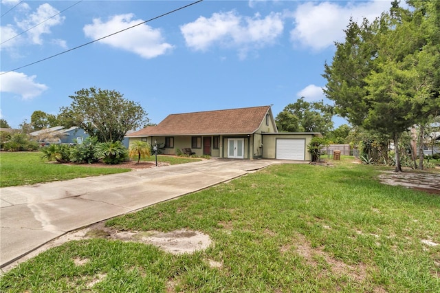 40533 E 8th Ave, Umatilla, FL 32784 - view of front facade with an attached garage and driveway