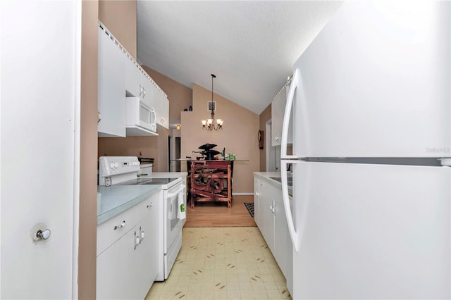 40533 E 8th Ave, Umatilla, FL 32784 - kitchen featuring white appliances, vaulted ceiling, a chandelier, light floors, and white cabinetry