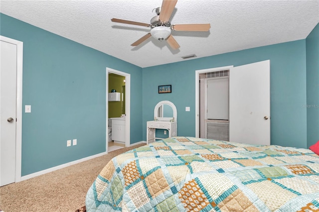 40533 E 8th Ave, Umatilla, FL 32784 - bedroom featuring carpet floors, a textured ceiling, a ceiling fan, and connected bathroom