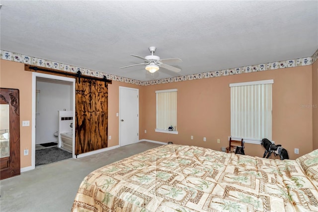 40533 E 8th Ave, Umatilla, FL 32784 - carpeted bedroom featuring a barn door, ceiling fan, and a textured ceiling