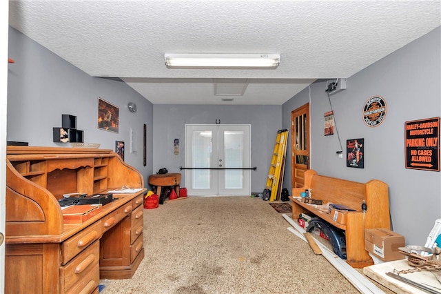 40533 E 8th Ave, Umatilla, FL 32784 - recreation room with carpet, french doors, and a textured ceiling