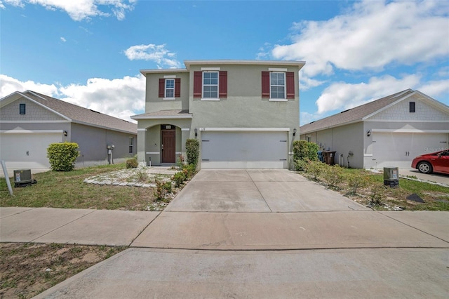 129 Eagleview Loop, Davenport, FL 33837 - traditional-style home with stucco siding, driveway, and a garage