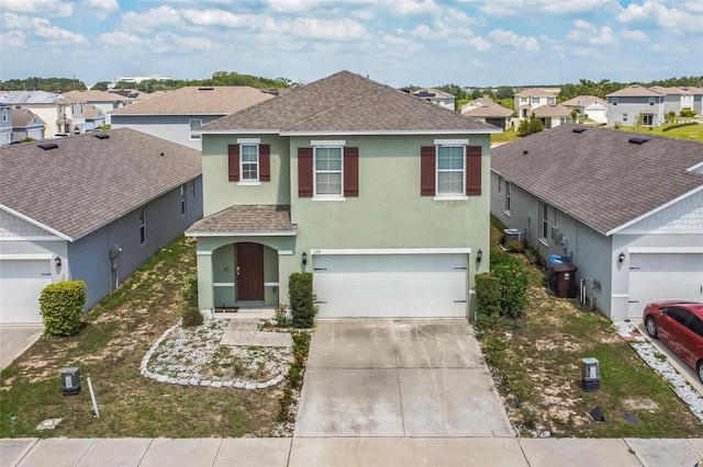 129 Eagleview Loop, Davenport, FL 33837 - traditional home featuring roof with shingles, stucco siding, a residential view, driveway, and an attached garage