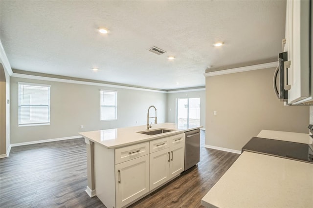 129 Eagleview Loop, Davenport, FL 33837 - kitchen featuring stainless steel appliances, crown molding, an island with sink, dark wood-style flooring, and white cabinets
