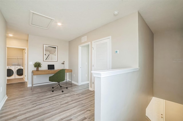 129 Eagleview Loop, Davenport, FL 33837 - office area featuring washer and dryer, light wood-style floors, and attic access