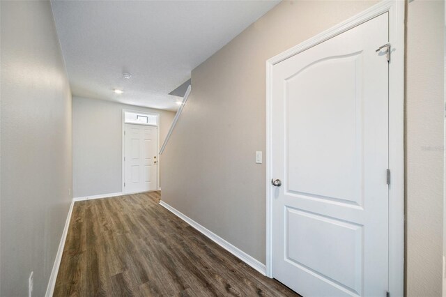 129 Eagleview Loop, Davenport, FL 33837 - hallway with dark wood-style flooring and baseboards