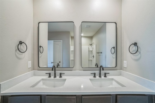 129 Eagleview Loop, Davenport, FL 33837 - bathroom with double vanity and a textured wall
