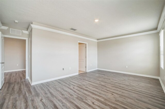 129 Eagleview Loop, Davenport, FL 33837 - unfurnished room with ornamental molding, wood finished floors, and a smoke detector