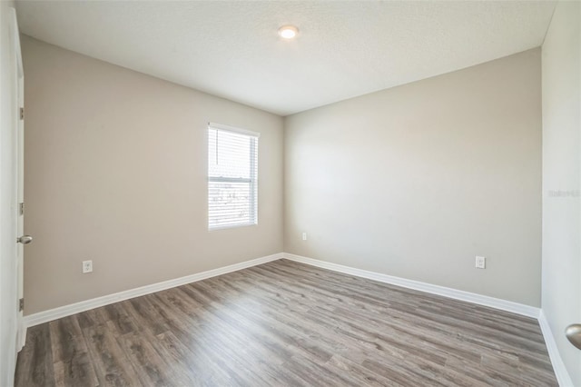 129 Eagleview Loop, Davenport, FL 33837 - unfurnished room with wood finished floors