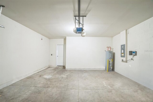 129 Eagleview Loop, Davenport, FL 33837 - garage with water heater, electric panel, and a garage door opener