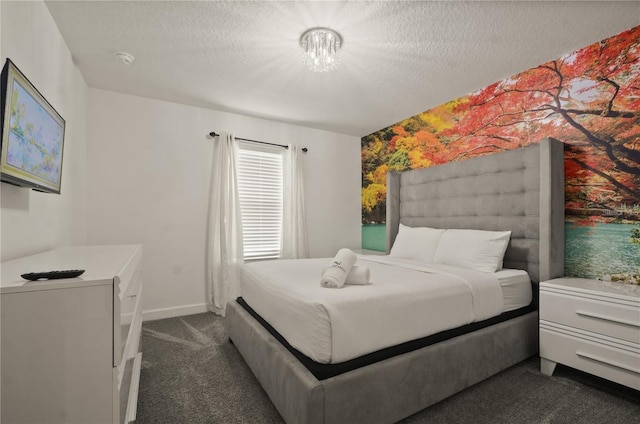 4363 Scene Ln, Kissimmee, FL 34746 - bedroom featuring dark colored carpet, a textured ceiling, a chandelier, and baseboards