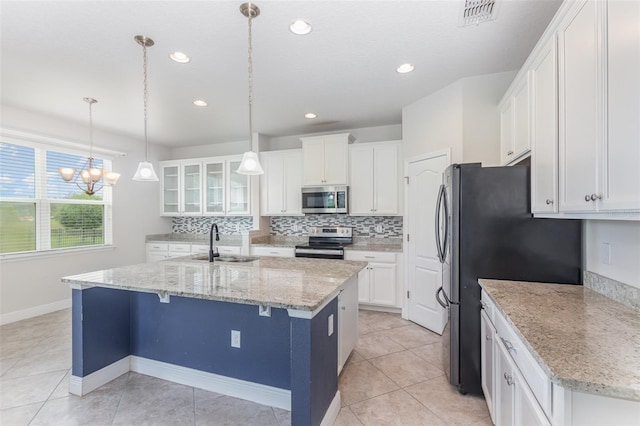 17044 Goldcrest Loop, Clermont, FL 34714 - kitchen with appliances with stainless steel finishes, a sink, backsplash, white cabinets, and recessed lighting