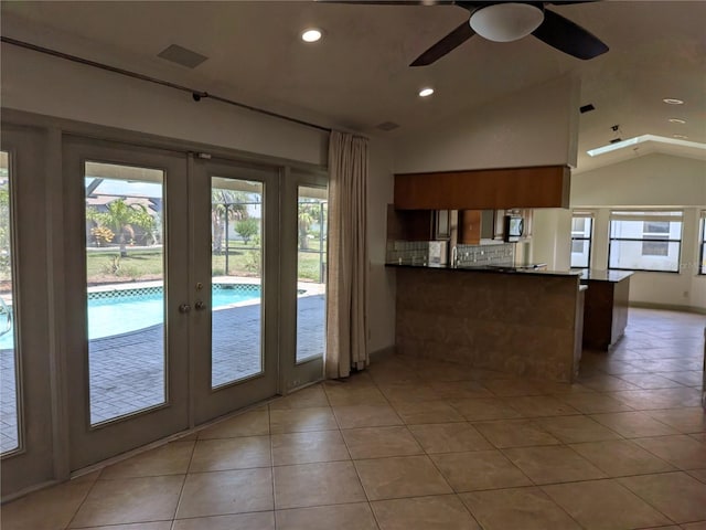 141 Angol St, Punta Gorda, FL 33983 - doorway to outside with lofted ceiling, plenty of natural light, recessed lighting, a ceiling fan, and light tile patterned floors