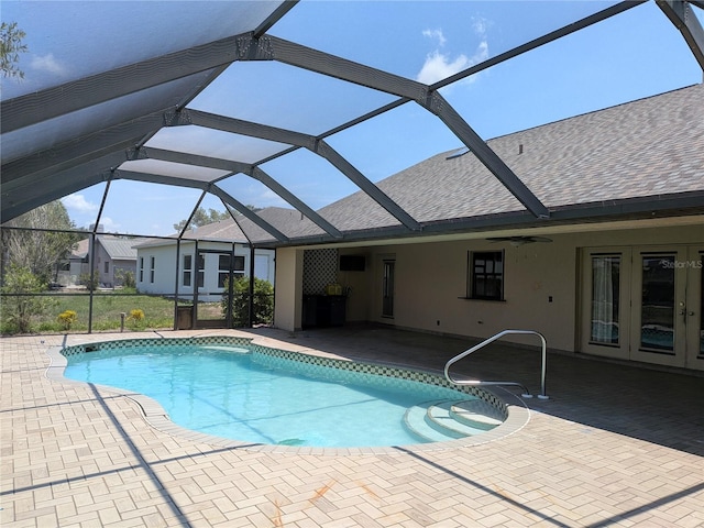 141 Angol St, Punta Gorda, FL 33983 - swimming pool with french doors, a patio area, and glass enclosure