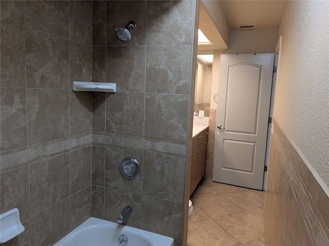 141 Angol St, Punta Gorda, FL 33983 - bathroom with vanity, tile patterned flooring, and washtub / shower combination