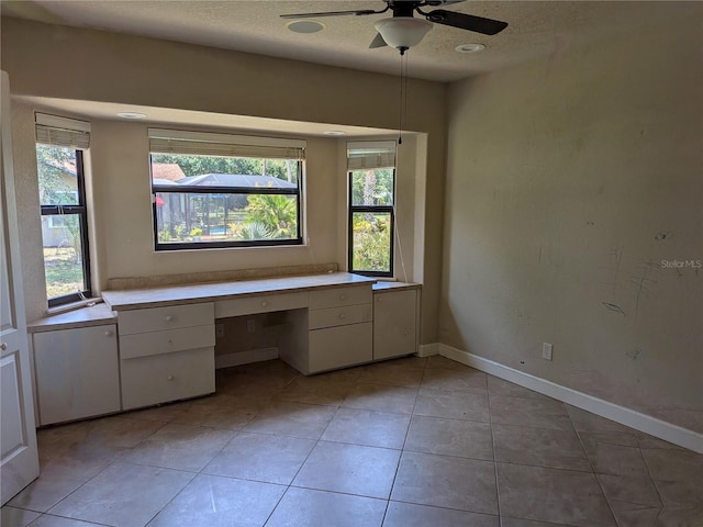 141 Angol St, Punta Gorda, FL 33983 - unfurnished office featuring ceiling fan, healthy amount of natural light, a textured ceiling, light tile patterned floors, and baseboards