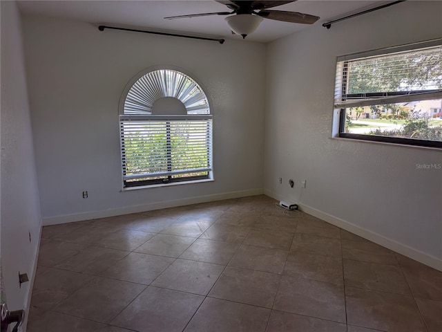 141 Angol St, Punta Gorda, FL 33983 - tiled empty room featuring ceiling fan and baseboards