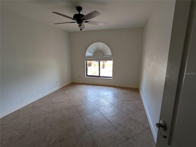 141 Angol St, Punta Gorda, FL 33983 - tiled empty room with baseboards, ceiling fan, and a textured wall