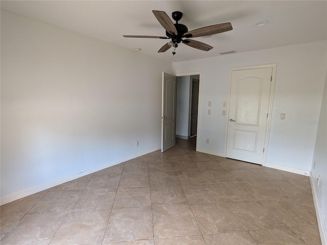 141 Angol St, Punta Gorda, FL 33983 - empty room with a ceiling fan, light tile patterned floors, and baseboards