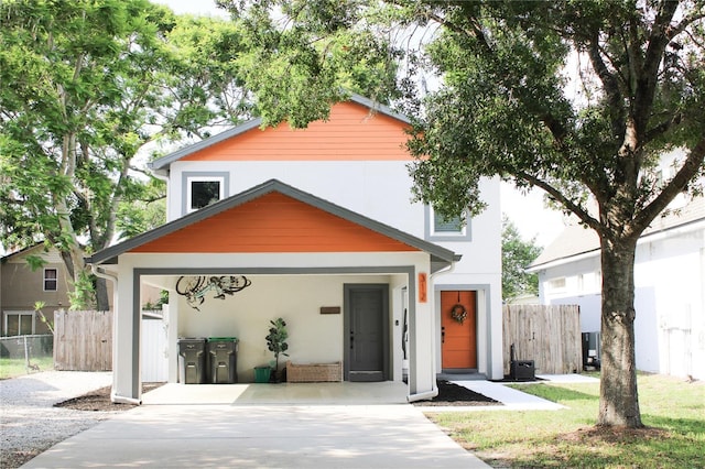 312 W Hull Ave, Oakland, FL 34760 - view of front of home featuring driveway and stucco siding