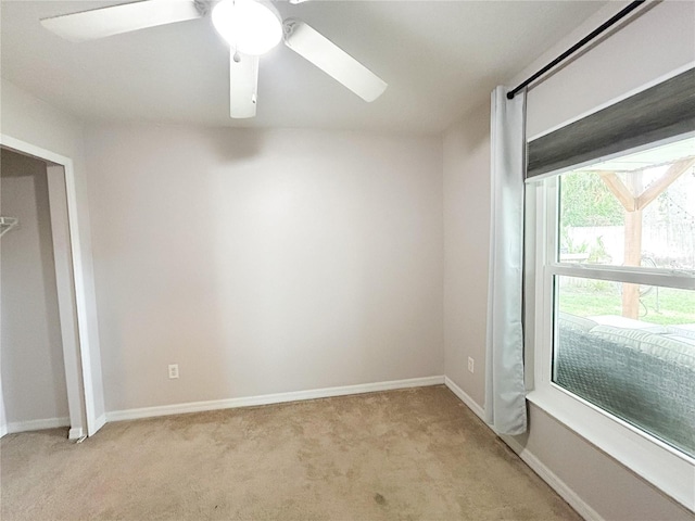 312 W Hull Ave, Oakland, FL 34760 - unfurnished bedroom featuring light carpet, ceiling fan, and baseboards