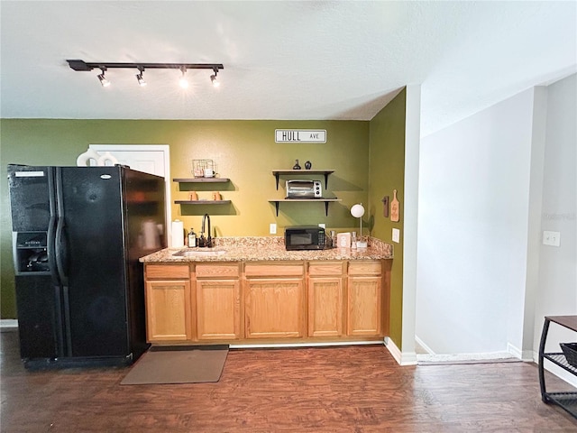 312 W Hull Ave, Oakland, FL 34760 - kitchen with black appliances, a sink, dark wood finished floors, and rail lighting
