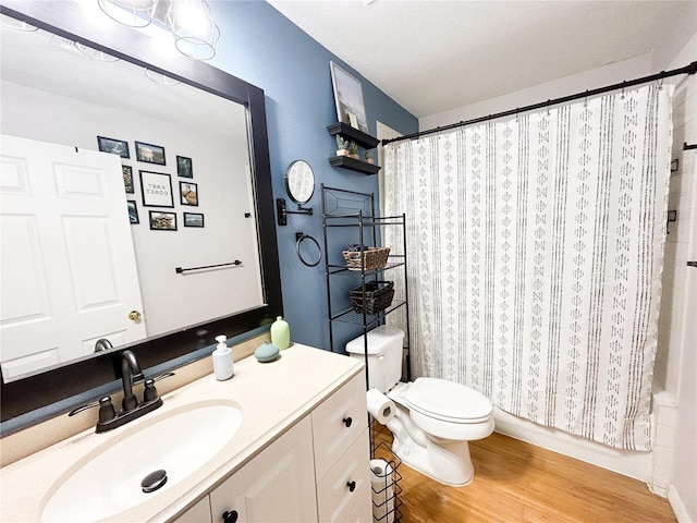 312 W Hull Ave, Oakland, FL 34760 - bathroom featuring vanity, wood finished floors, and toilet