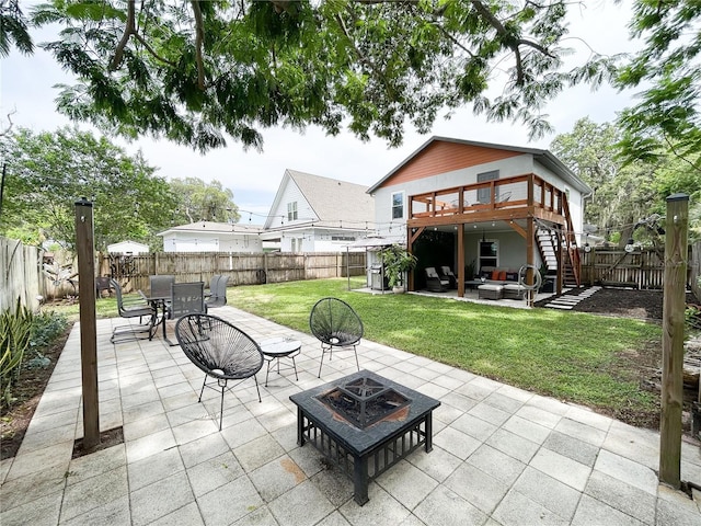 312 W Hull Ave, Oakland, FL 34760 - view of patio / terrace with stairway, an outdoor living space with a fire pit, a wooden deck, and outdoor dining area