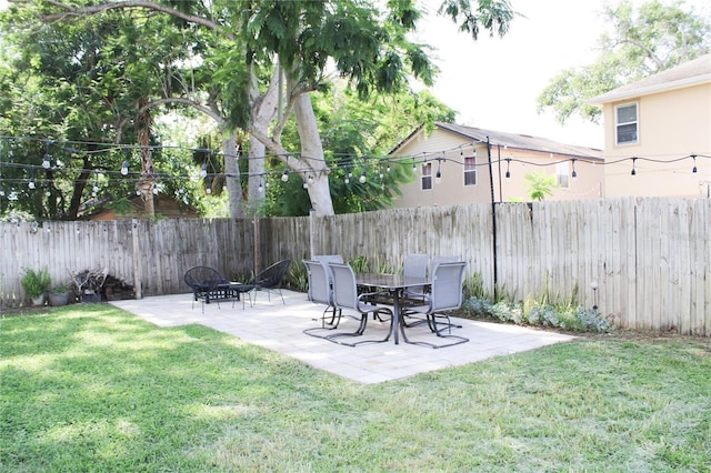 312 W Hull Ave, Oakland, FL 34760 - view of yard with a patio area and a fire pit