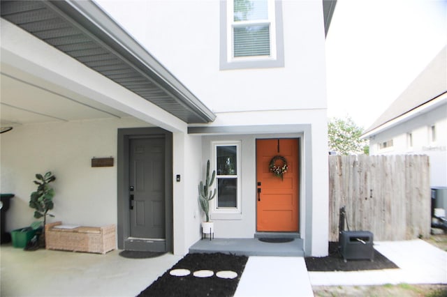 312 W Hull Ave, Oakland, FL 34760 - doorway to property with stucco siding