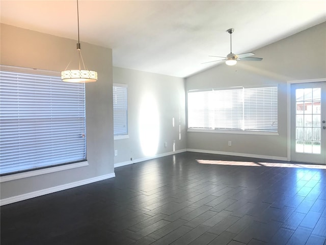 10969 Norcross Cir, Orlando, FL 32825 - empty room featuring dark wood-type flooring, ceiling fan, baseboards, and lofted ceiling