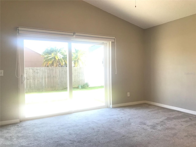 10969 Norcross Cir, Orlando, FL 32825 - unfurnished room with carpet, vaulted ceiling, and baseboards