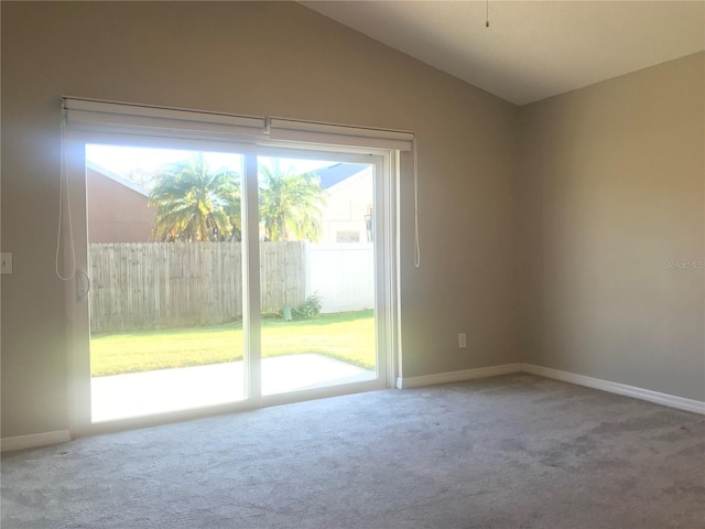 10969 Norcross Cir, Orlando, FL 32825 - empty room with carpet, lofted ceiling, and baseboards