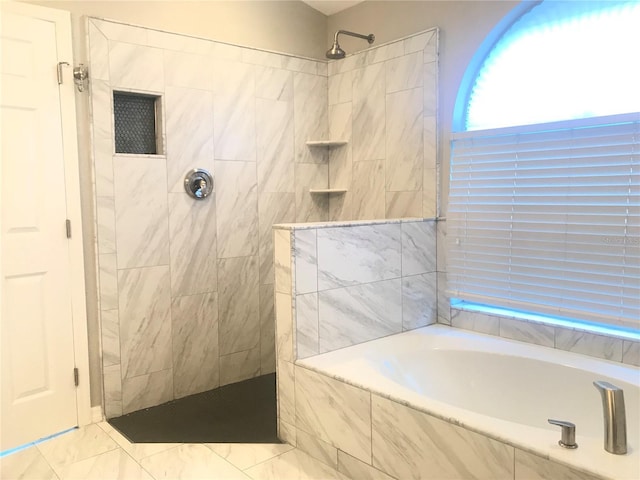 10969 Norcross Cir, Orlando, FL 32825 - full bathroom featuring a bath, a tile shower, and marble finish floors