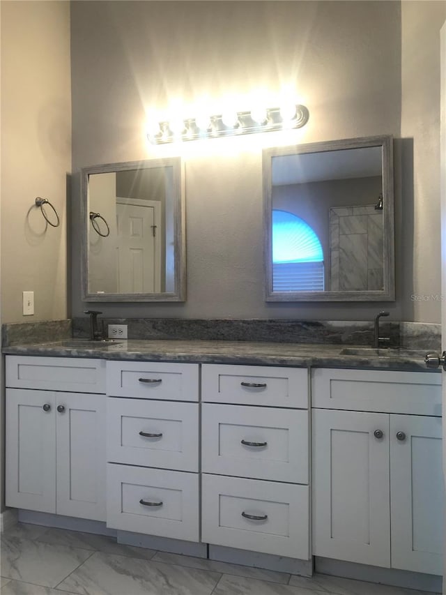 10969 Norcross Cir, Orlando, FL 32825 - bathroom with double vanity and marble finish floors