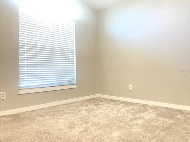 10969 Norcross Cir, Orlando, FL 32825 - unfurnished room featuring carpet floors and baseboards