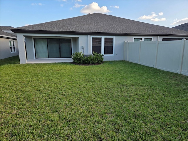 12513 Oak Hill Way, Parrish, FL 34219 - rear view of house featuring stucco siding and a shingled roof