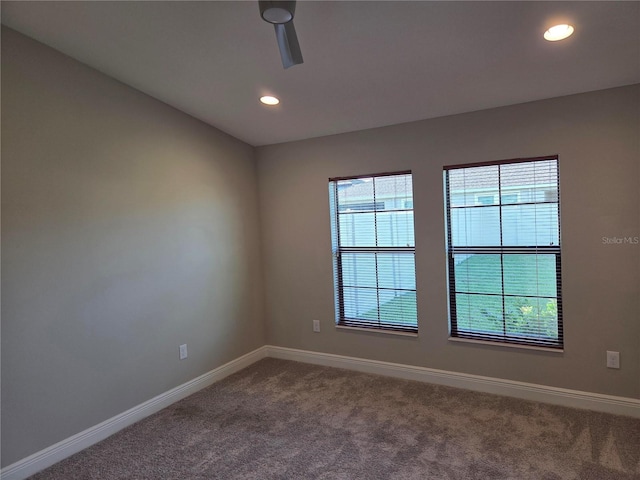 12513 Oak Hill Way, Parrish, FL 34219 - unfurnished room with dark colored carpet, baseboards, and recessed lighting