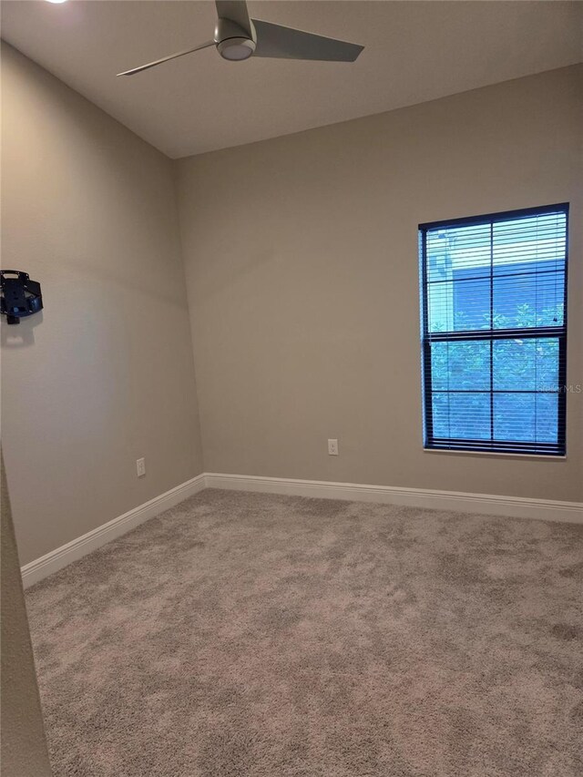 12513 Oak Hill Way, Parrish, FL 34219 - carpeted spare room with ceiling fan and baseboards