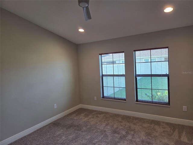 12513 Oak Hill Way, Parrish, FL 34219 - spare room with dark colored carpet and recessed lighting