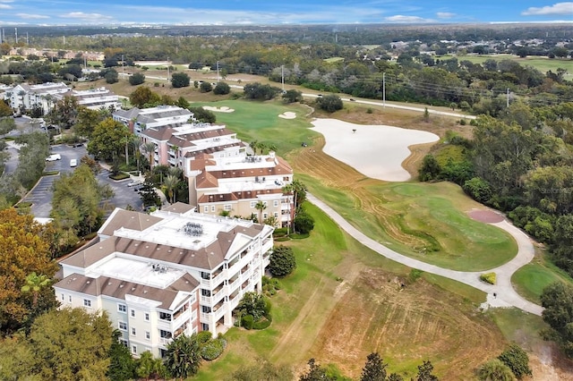 7616 Cabana Ct Unit 301, Reunion, FL 34747 - aerial view of a golf club, apartment complex, and a tree filled landscape